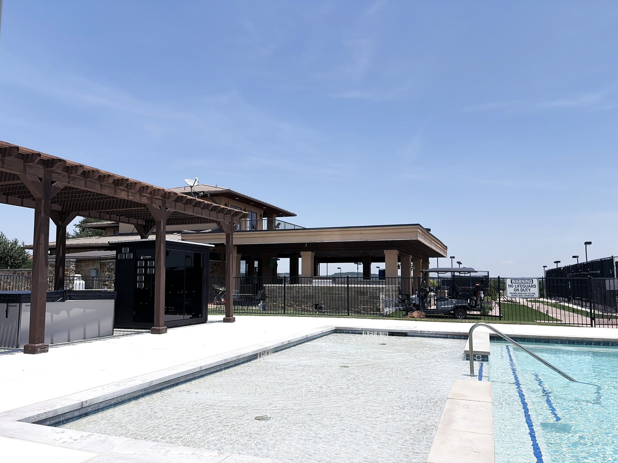 The resort-style pool at Lakecliff Racquet Club on a summer afternoon